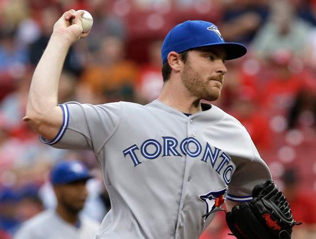 Toronto Blue Jays starting pitcher Liam Hendriks throws against the Cincinnati Reds in the first inning of a baseball game, Friday, June 20, 2014, in Cincinnati. (AP Photo/Al Behrman).