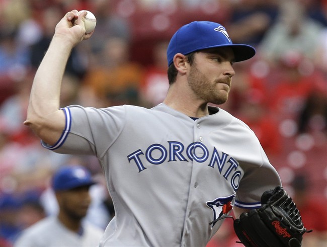 Toronto Blue Jays starting pitcher Liam Hendriks throws against the Cincinnati Reds in the first inning of a baseball game, Friday, June 20, 2014, in Cincinnati. (AP Photo/Al Behrman).