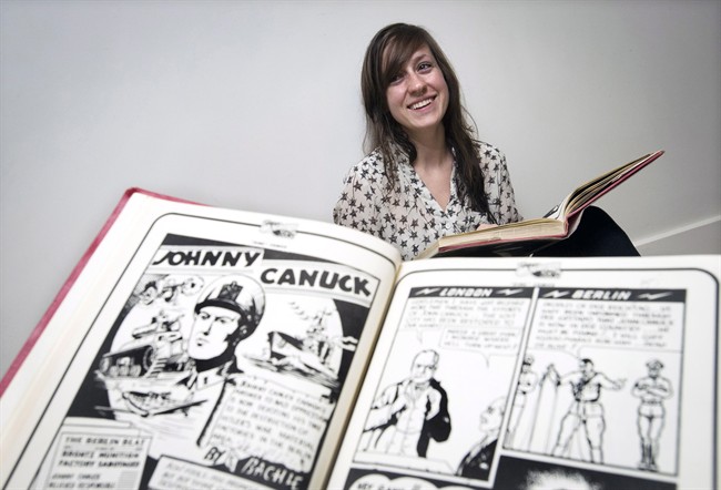 Archivist and publisher Rachel Richey poses next to a splash page of "Johnny Canuck" in Toronto on Wednesday, June 25, 2014.