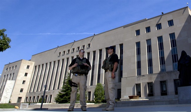 U.S. Marshalls guard the area outside of the federal U.S. District Court in Washington Saturday, June 28, 2014, after security was heightened in anticipation of a possible court appearance by captured Libyan militant Ahmed Abu Khattala later in the day. (AP Photo/Jose Luis Magana).
