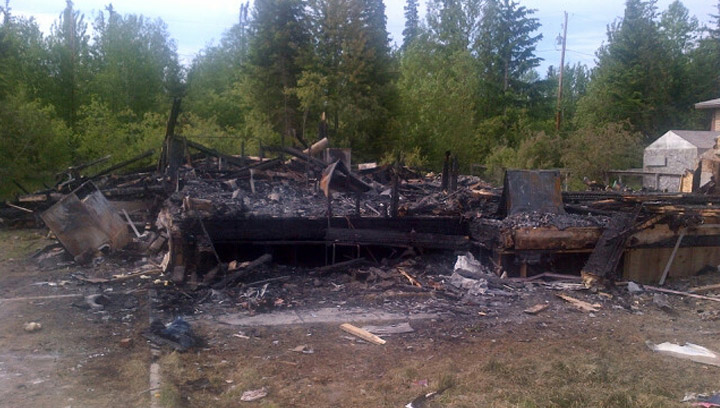 Mountie pulls woman from burning house in the northern Saskatchewan community of Deschambault Lake.