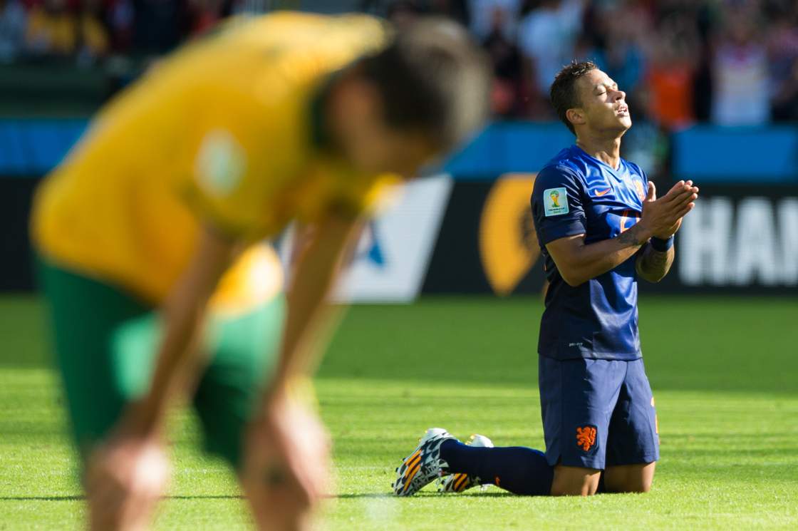 PORTO ALEGRE, BRAZIL - JUNE 18: Memphis Depay of the Netherlands celebrates his team's victory during the FIFA World Cup Brazil 2014 Group B match between Australia and the Netherlands at the Beira-Rio Stadium on June 18, 2014, in Porto Alegre, Brazil. (Photo by Vinicius Costa/ Getty Images)