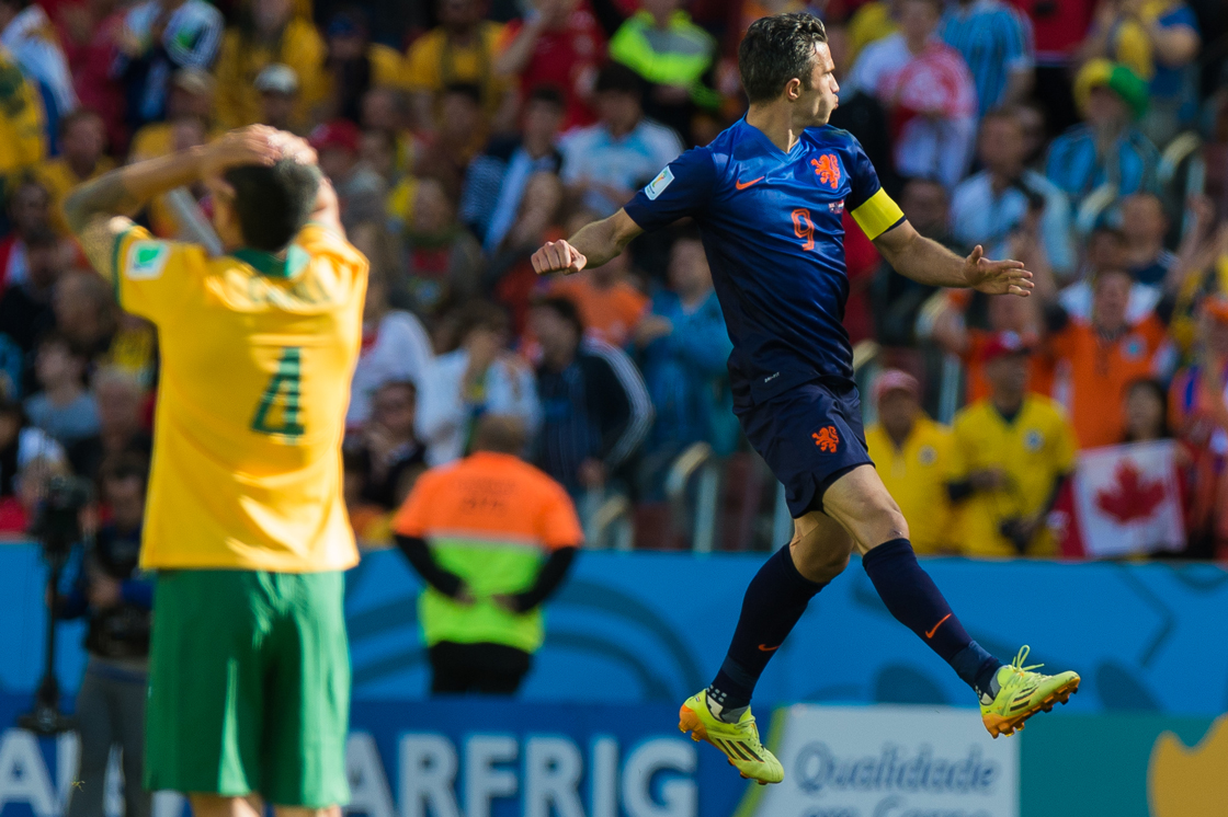 PORTO ALEGRE, BRAZIL - JUNE 18: Robin Van Persie of the Netherlands celebrates after scoring the team's second goal during the 2014 FIFA World Cup Brazil Group B match between Australia and Netherlands at Estadio Beira-Rio on June 18, 2014 in Porto Alegre, Brazil. (Photo by Vinicius Costa/ Getty Images)