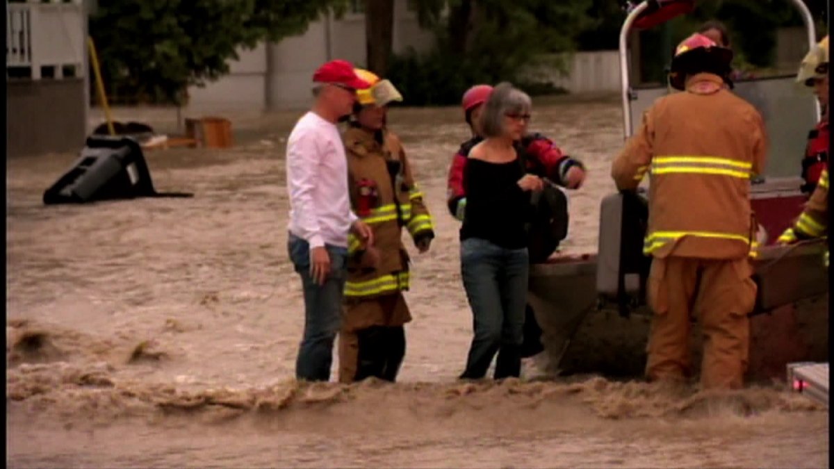 Calgary firefighters came to the rescue of Calgarians who were stranded when floodwaters swamped their neighbourhoods. June 21, 2013.