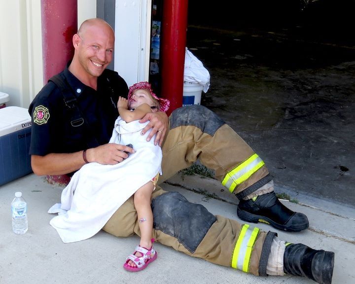 A smiling Shawn Wiebe with his sleeping daughter. Courtesy of Shawn Wiebe.