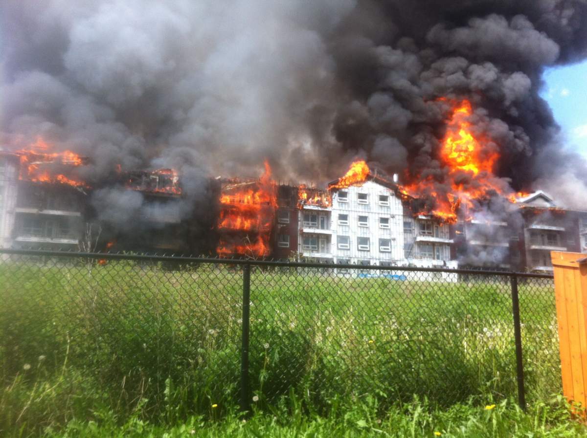 Huge plumes of dark smoke could be seen coming out of the Fort McMurray condo complex Friday afternoon.