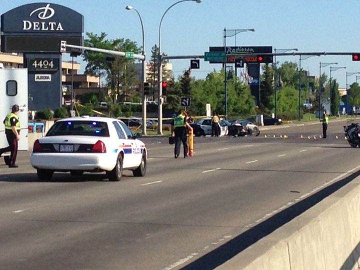 Police investigate a two-vehicle collision involving a cruiser on Gateway Blvd. at Whitemud Drive Saturday, June 7, 2014.