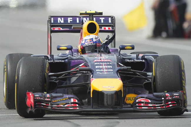 Red Bull driver Daniel Ricciardo from Australia waves to fans after winning the Canadian Grand Prix in Montreal.