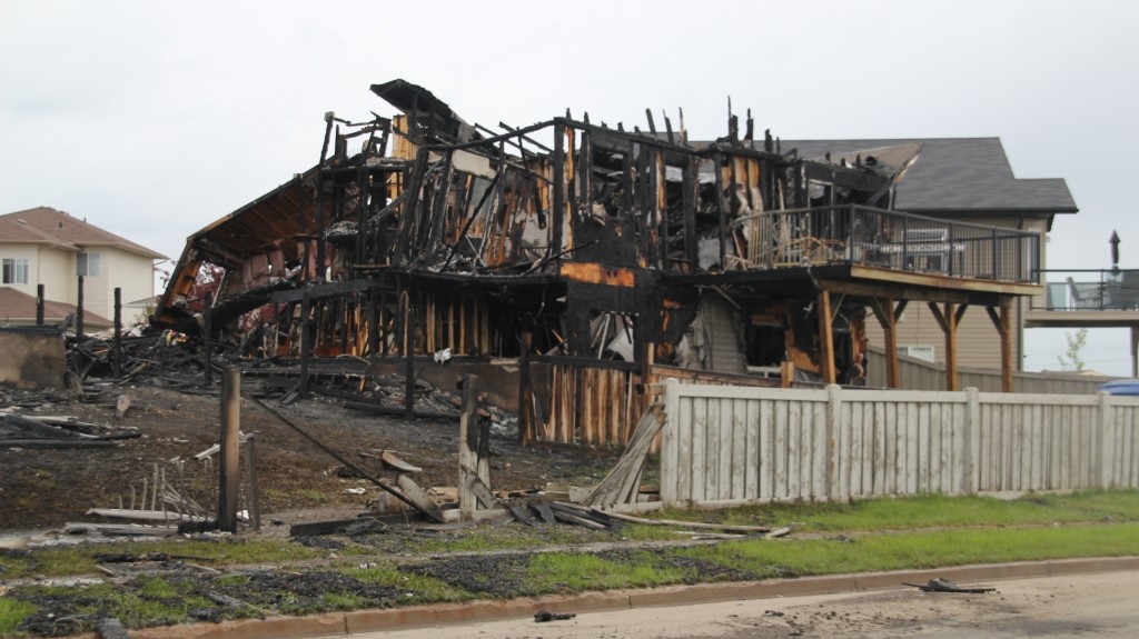 A fire destroyed two homes and damaged two others in a new neighbourhood in Grande Prairie, Wednesday, June 4, 2014. 
