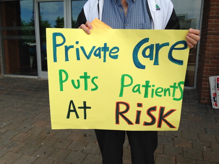 Community groups held a demonstration in front of the offices for the Nova Scotia College of Physicians and Surgeons.