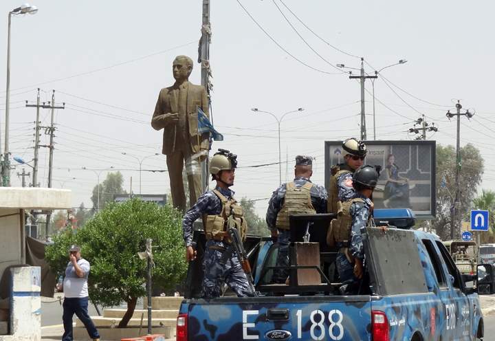 Kurdish Iraqi security forces patrol a street in the northern oil city of Kirkuk on June 13, 2014, as jihadist militants push their offensive towards the capital Baghdad. 