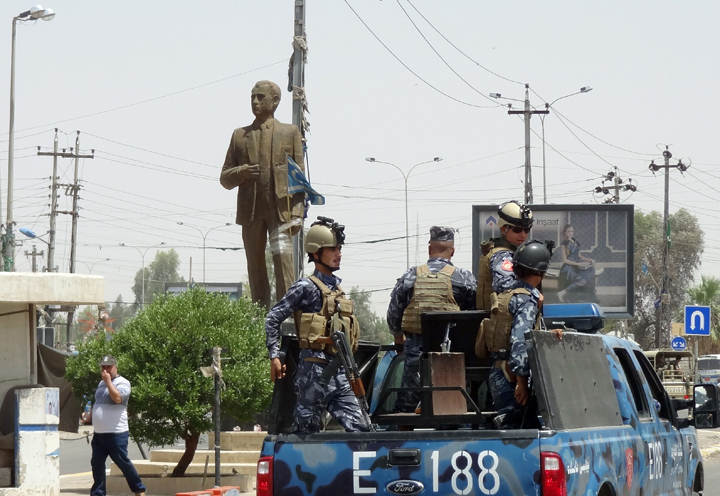 Kurdish Iraqi security forces patrol a street in the northern oil city of Kirkuk on June 13, 2014, as jihadist militants push their offensive towards the capital Baghdad. 