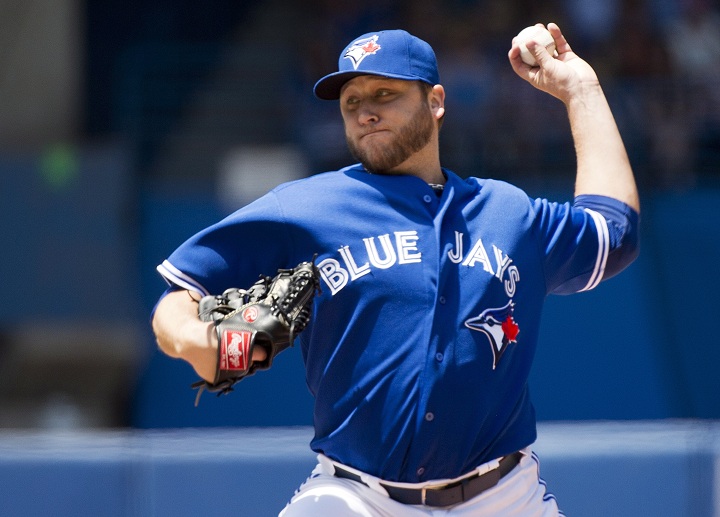 Toronto Blue Jays starting pitcher Mark Buehrle works against the Kansas City Royals during first inning AL baseball action in Toronto on Sunday, June 1, 2014.