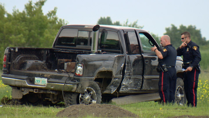 Driver arrested after stolen truck rams Saskatoon police cruiser, collides with several vehicles during afternoon rush hour.