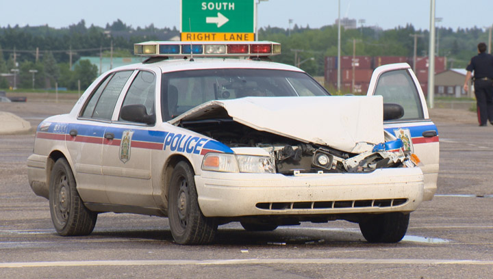 Driver arrested after stolen truck rams Saskatoon police cruiser, collides with several vehicles during afternoon rush hour.