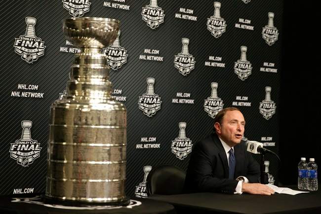 NHL Commissioner Gary Bettman speaks during a news conference before Game 1 of the NHL Stanley Cup Final hockey series between the Los Angeles Kings and the New York Rangers on Wednesday, June 4, 2014, in Los Angeles. (AP Photo/Jae C. Hong).