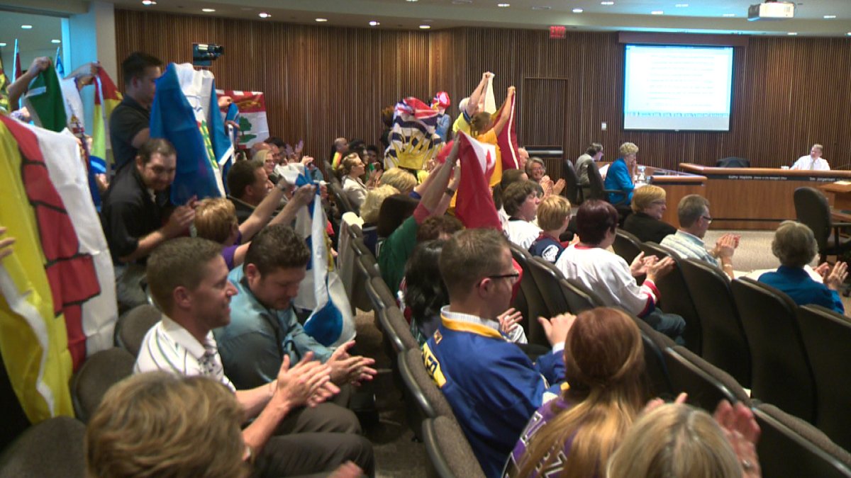 Observers cheer after Lethbridge city council unanimously approved supporting the city's bid for the 2019 Canada Winter Games. 