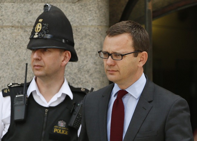 Andy Coulson, former News of the World editor and the former spin doctor of British Prime Minister David Cameron, leaves the Central Criminal Court in London, Wednesday, June 25, 2014. 