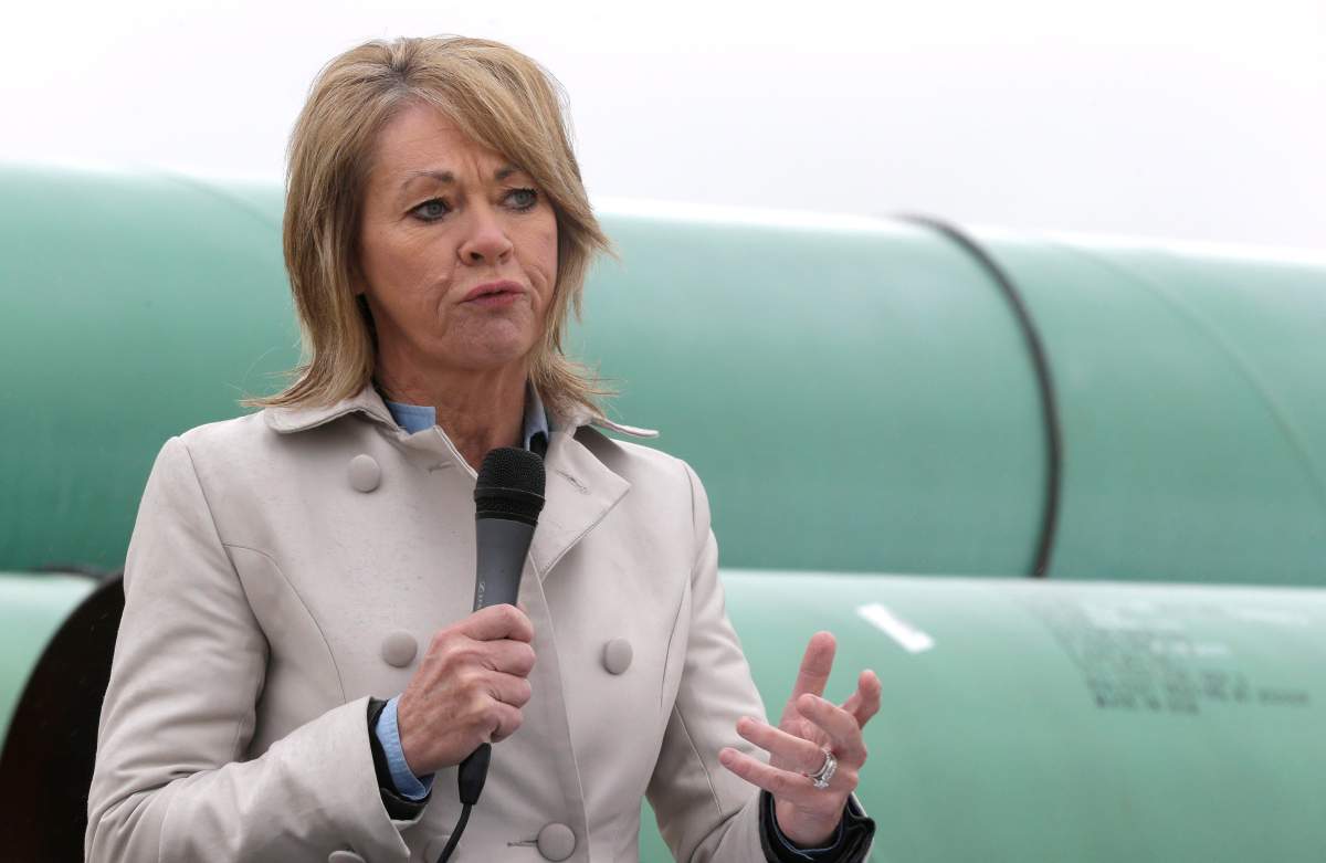 Alberta's energy minister Diana McQueen speaks at the TransCanada pipe yard for the Houston Lateral Project Wednesday, March 5, 2014, in Mont Belvieu, Texas.