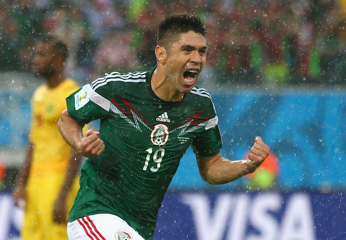 NATAL, BRAZIL - JUNE 13: Oribe Peralta of Mexico celebrates his goal in the second half during the 2014 FIFA World Cup Brazil Group A match between Mexico and Cameroon at Estadio das Dunas on June 13, 2014 in Natal, Brazil. (Photo by Julian Finney/Getty Images)
