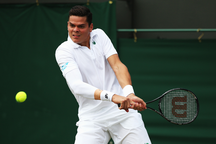 Milos Raonic in action during second round match against Jack Sock of the United States on day four of the Wimbledon Lawn Tennis Championships at the All England Lawn Tennis and Croquet Club at Wimbledon on June 26, 2014 in London, England.  