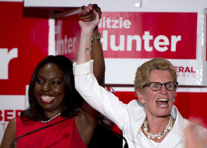 Ontario Premier Kathleen Wynne (right) celebrates with Mitzie Hunter after Hunter won the riding of Scarborough-Guildwood in an Ontario provincial by-election on Thursday August 1, 2013.
