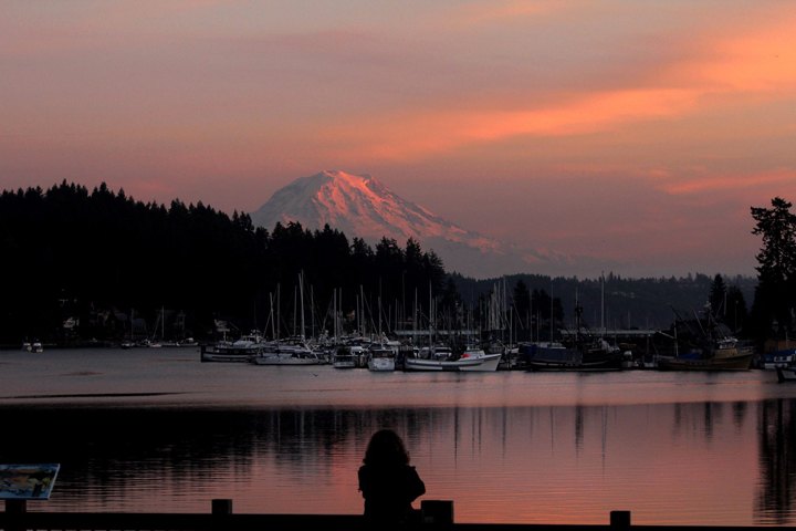 Mount Rainier glows at dusk on Wednesday, Jan. 15, 2014, seen from the Bogue Viewing Platform in Gig Harbor, Wash.  