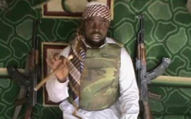 FILE - This file image made available from Wednesday, Jan. 10, 2012, taken from video posted by Boko Haram sympathizers shows Imam Abubakar Shekau, the leader of the radical Islamist sect. Boko Haram militants dressed as soldiers slaughtered at least 200 civilians in three villages in northeastern Nigeria and the military failed to intervene even though it was warned that an attack was imminent, witnesses said on Thursday, June 5, 2014. THE ASSOCIATED PRESS CANNOT INDEPENDENTLY VERIFY THE CONTENT, DATE, LOCATION OR AUTHENTICITY OF THIS MATERIAL.