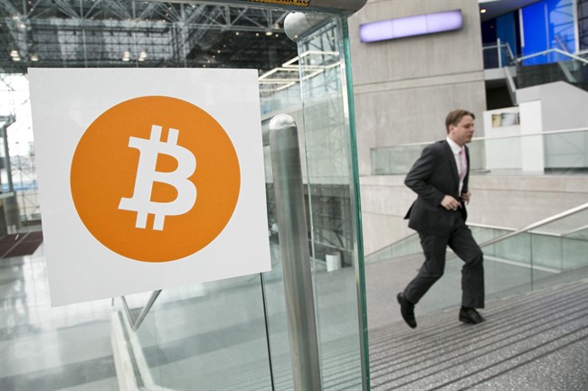 FILE - In this April 7, 2014 file photo, a man arrives for the Inside Bitcoins conference and trade show in New York.