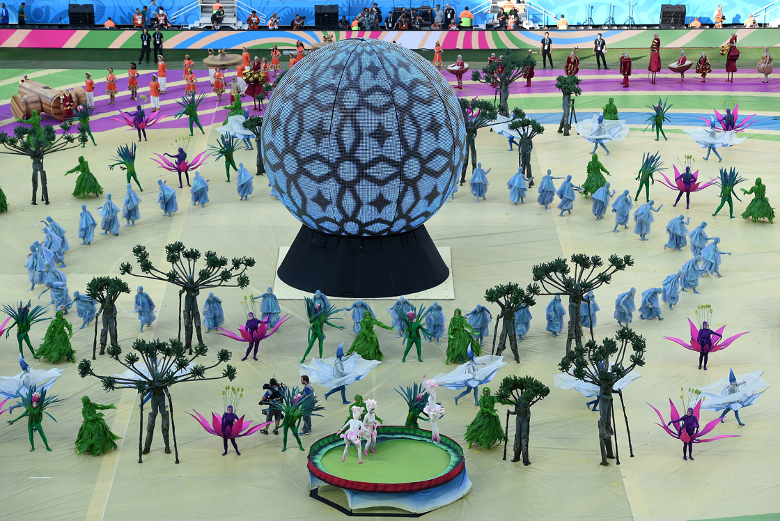 Performers take part in the opening ceremony of the 2014 FIFA World Cup at the Corinthians Arena in Sao Paulo on June 12, 2014. AFP PHOTO / FABRICE COFFRINI (Photo credit should read FABRICE COFFRINI/AFP/Getty Images)