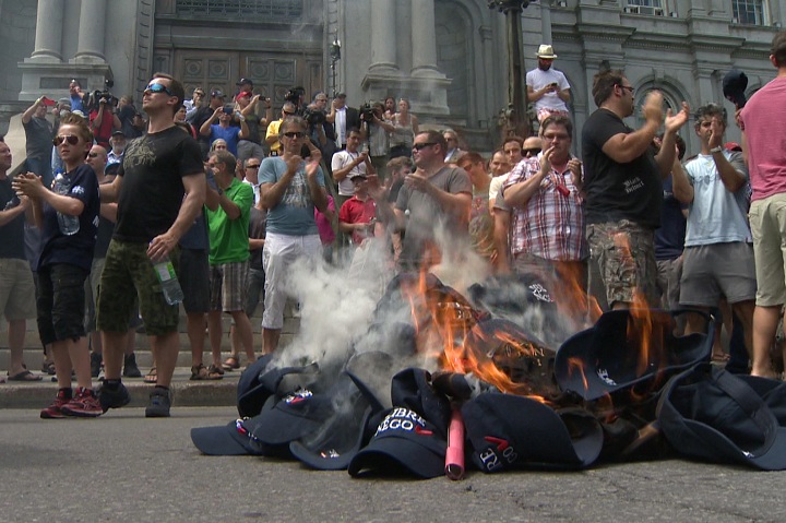 Hundreds of city workers in Montreal participated in protests with firefighters lighting hats on fire to show their frustration with proposed pension reforms on June 17, 2014.