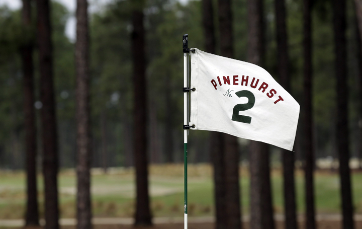 In this April 14, 2014, file photo, a flag on the 10th green blows in the wind at Pinehurst Resort & Country Club’s Course No. 2 in Pinehurst, N.C. 