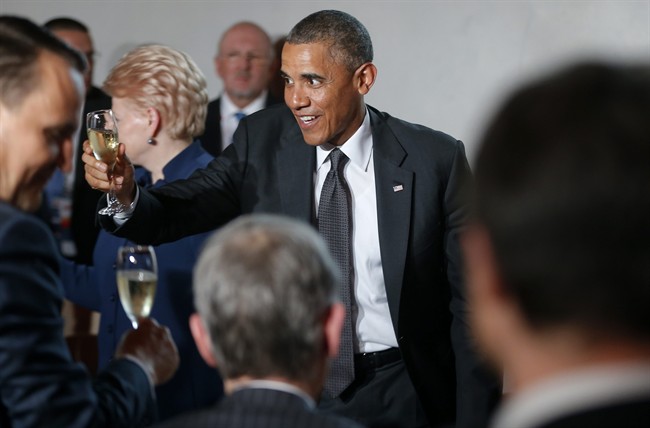 Barack Obama toasts European leaders as he attends a dinner at the Royal Castle in Warsaw, Poland, Tuesday, June 3, 2014. 