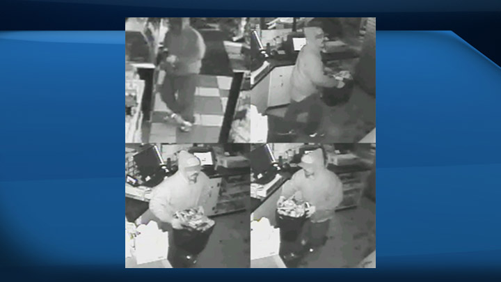 Surveillance footage at a Prince Albert store being robbed by a suspect.