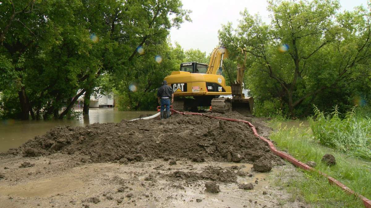 The creek that snakes through the Sherwood Forest Golf & Country Club tore through this portion of road Monday morning.