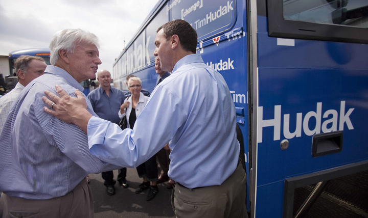 Ontario PC leader Tim Hudak, right, says goodbye to Chatham-Kent-Essex PC candidate Rick Nicholls following a campaign stop at J.B. Coatings in Chatham Ontario, Tuesday, September 13, 2011.