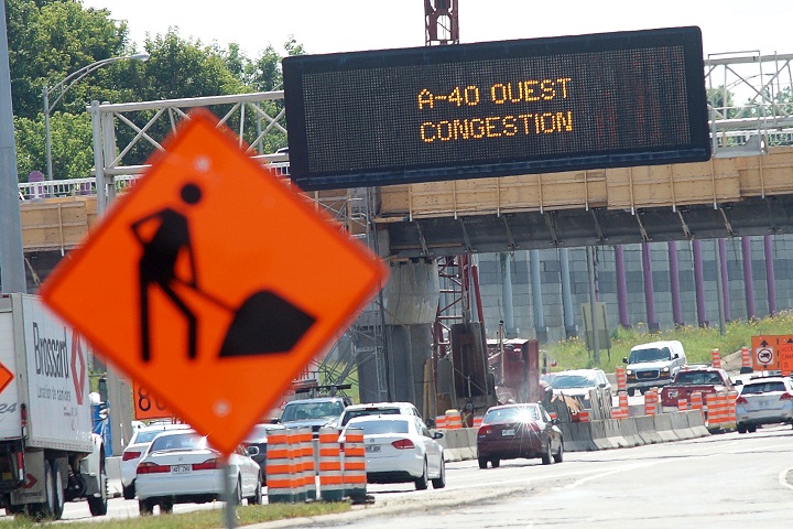 Repair cones and detour signs on Autoroute 15 in Laval, Que.