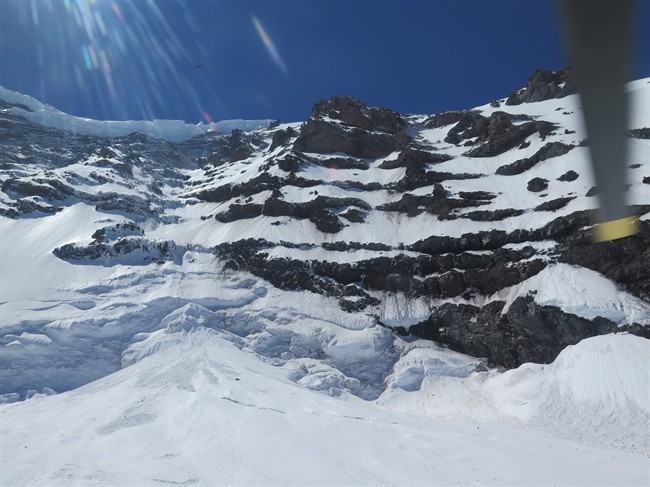 This photo provided by the National Parks Service, shows the Liberty Ridge Area of Mount Rainier as viewed from the Carbon Glacier, Saturday, May 31, 2014, in Washington state. 