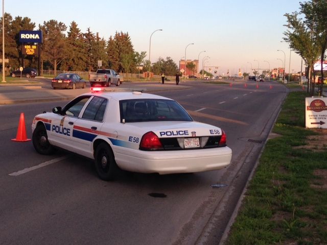 A section of Ellerslie Rd. is closed in southeast Edmonton as police investigate a shooting, Wednesday, June 18, 2014. 