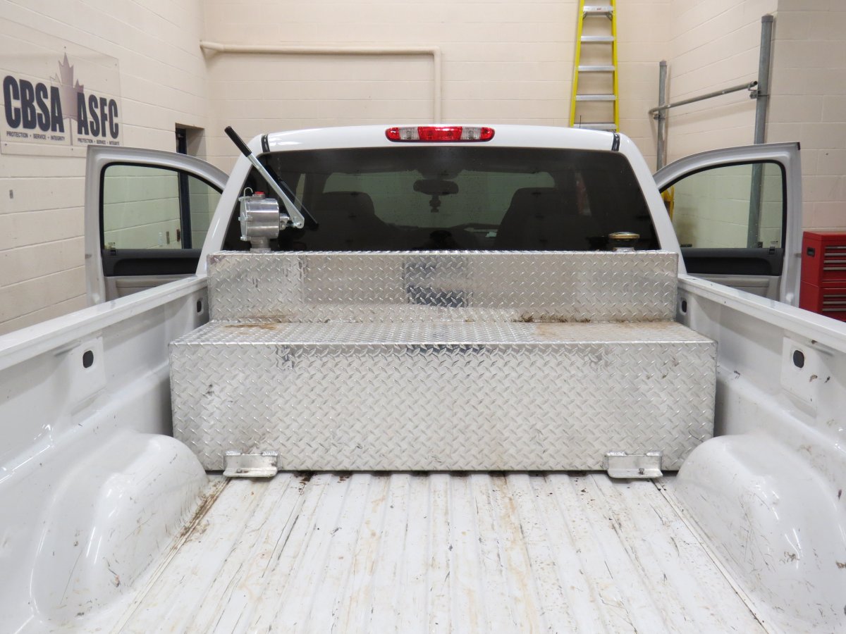 Woman found hiding in truck compartment at Alberta border crossing - image