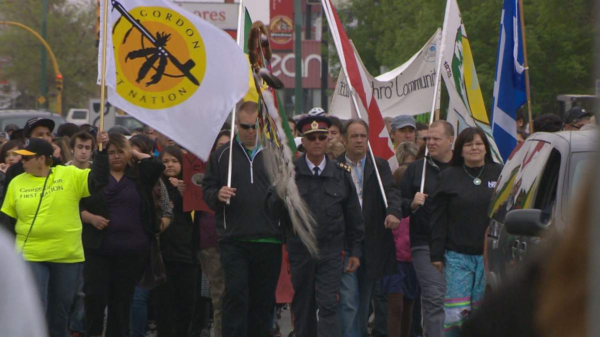 At Smudge Walk North Central Monday morning, Regina Police Chief Troy Hagen (center) emphasized community involvement in bettering the neighbourhood.