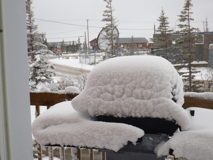 A barbecue needs a little shovelling on Thursday in Churchill, Man.