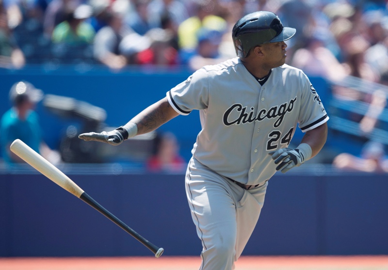 Chicago White Sox's Dayan Viciedo tosses his bat after hitting a three-run home run in the seventh inning of MLB baseball action against the Toronto Blue Jays in Toronto on Saturday, June 28, 2014. THE CANADIAN PRESS/Darren Calabrese.