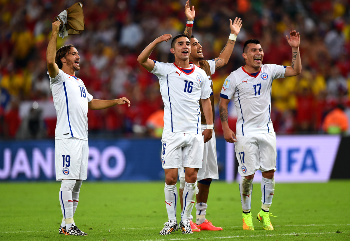 RIO DE JANEIRO, BRAZIL - JUNE 18: Jose Pedro Fuenzalida, Felipe Gutierrez and Gary Medel of Chile celebrate a 2-0 victory over Spain in the 2014 FIFA World Cup Brazil Group B match between Spain and Chile at Maracana on June 18, 2014 in Rio de Janeiro, Brazil. (Photo by David Ramos/Getty Images)