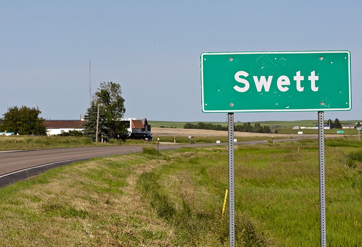 In this June 26, 2014 photo, a road marker highlights Swett, S.D.'s small borders.