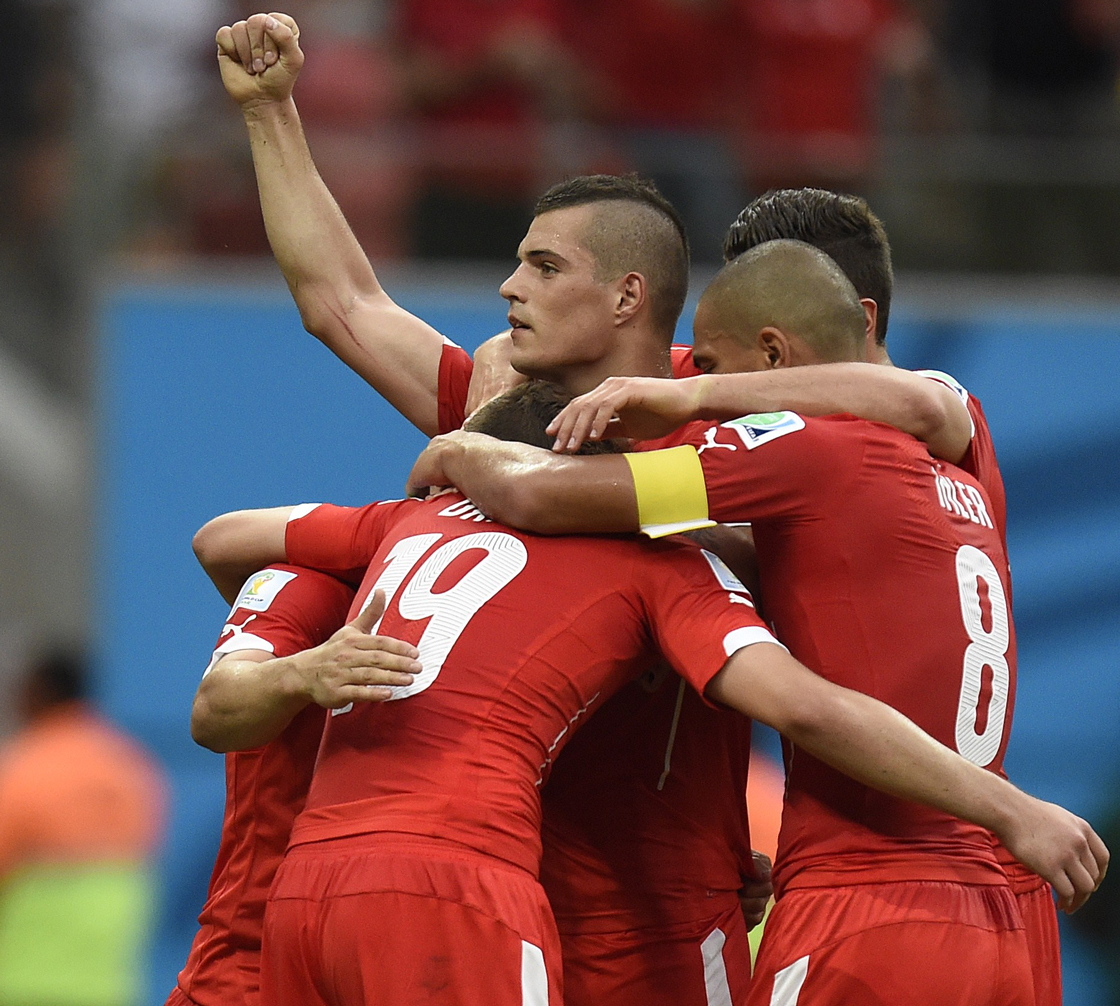 Switzerland's players celebrate after scoring their third goal during the Group E football match between Honduras and Switzerland at the Amazonia Arena in Manaus during the 2014 FIFA World Cup on June 25, 2014. AFP PHOTO / JUAN BARRETO (Photo credit should read JUAN BARRETO/AFP/Getty Images)