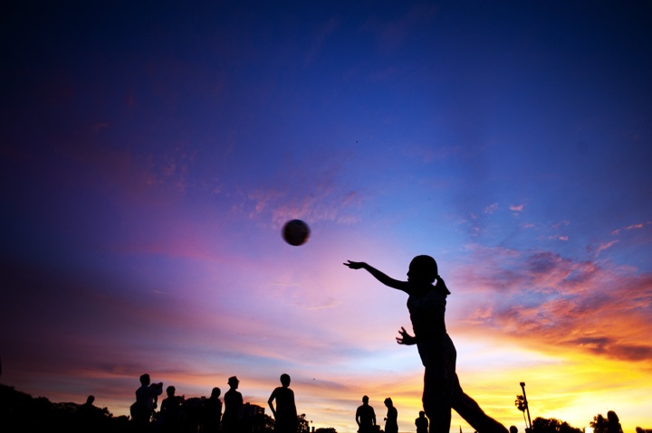 This photo taken on May 26, 2014 shows a girl throwing a football.