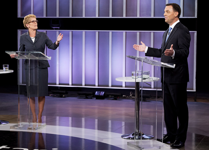 Ontario Premier Kathleen Wynne, left, and Ontario PC leader Tim Hudak take part in the live leaders debate at CBC during the Ontario election campaign in Toronto on Tuesday, June 3, 2014.