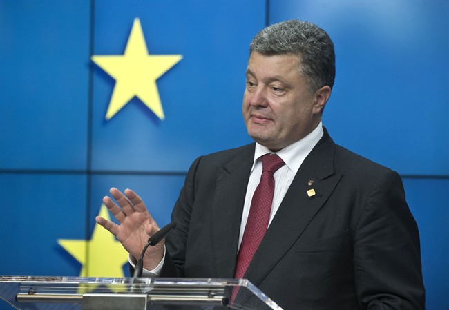 Ukrainian President Petro Poroshenko speaks during a media conference after a signing ceremony at an EU summit in Brussels on Friday, June 27, 2014.