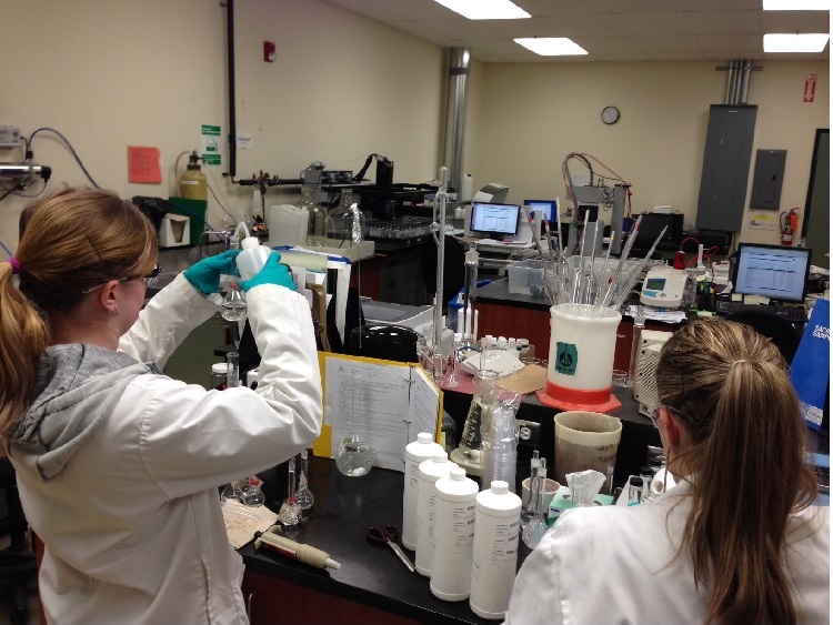 Two researchers testing water. Global News and CJOB 680 had water tested from 4 different sources.